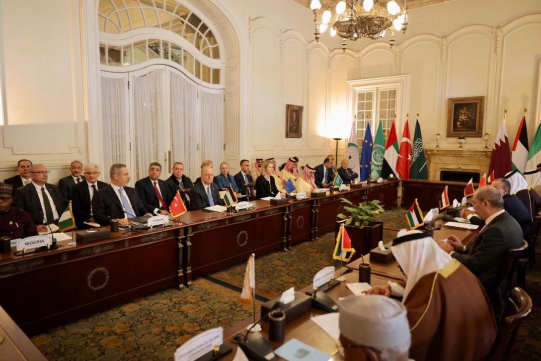 Officials and diplomats sitting in a meeting room