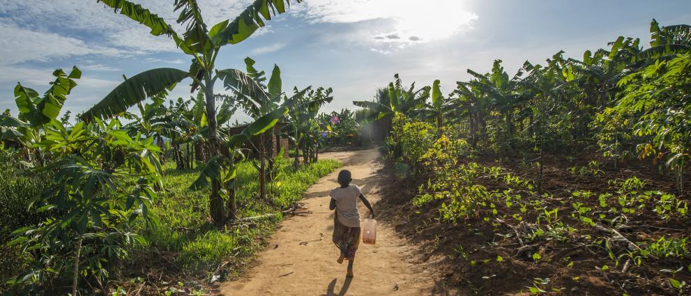 boy running on a dirt path