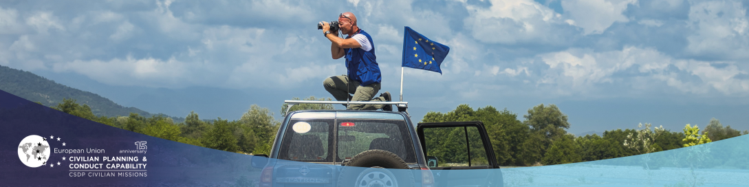 Civilian mission car with EU flag on a clear landscape