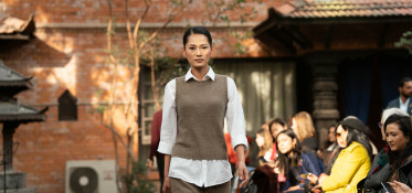 A model walks in Nepali pashmina sweater.