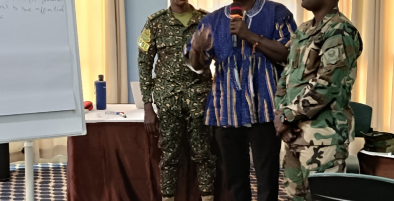 Participants and civilian representatives presenting the results of the discussion from the workshop