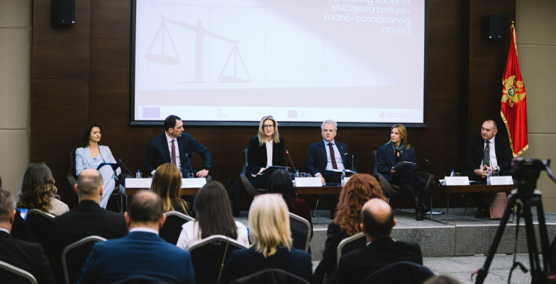 Officials sitting on stage
