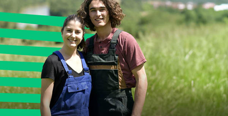 Two people standing in the field
