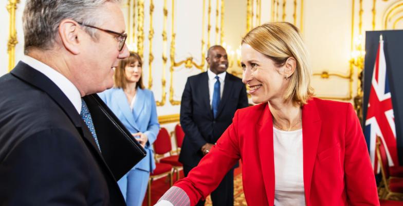 Foreground, Keir Starmer, UK PM, meets and greets HRVP Kaja Kallas, other dignitaries in background.