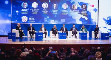 Group of people sitting on a stage
