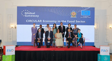 Officials of the CIRCULAR peoject post in front of a backdrop
