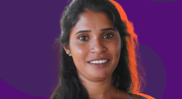 Surangi poses for a picture with her quote 