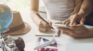 Young couple planning vacation trip