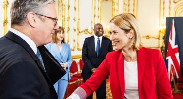 Foreground, Keir Starmer, UK PM, meets and greets HRVP Kaja Kallas, other dignitaries in background.