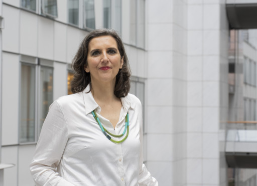 women with a building behind