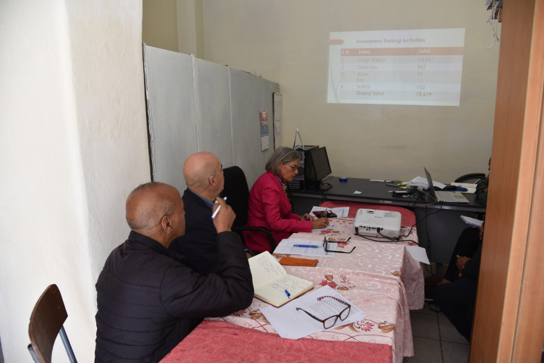 NAIDDE staff give a briefing