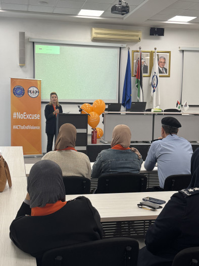 Woman explaining during the Orange Coffee Morning event