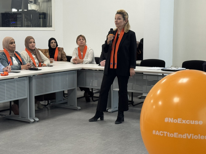 Woman talking during the Orange Coffee Morning event