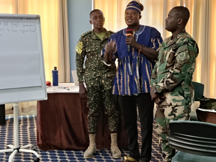 Participants and civilian representatives presenting the results of the discussion from the workshop