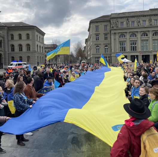 Support for Ukraine group holding big flag