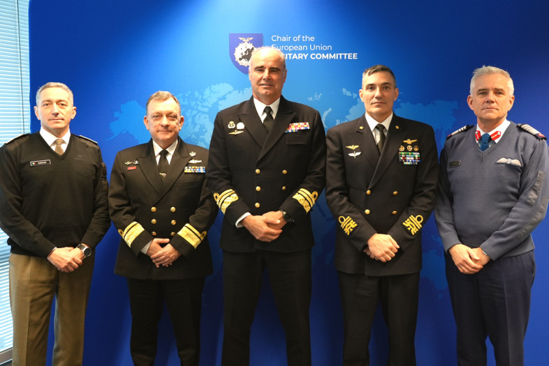 Five senior military officers pose for a photo.