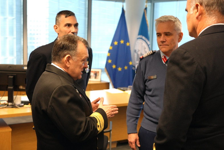 Four senior military leaders in discussions. 