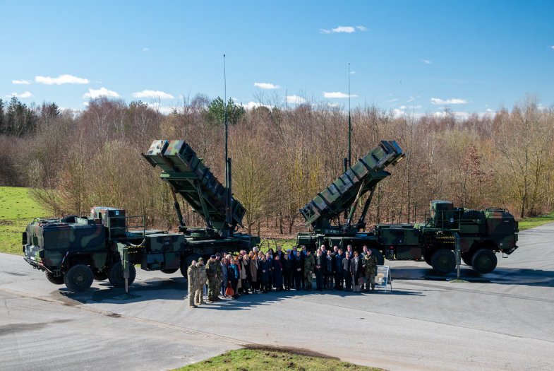 A weapons' system and group photo.