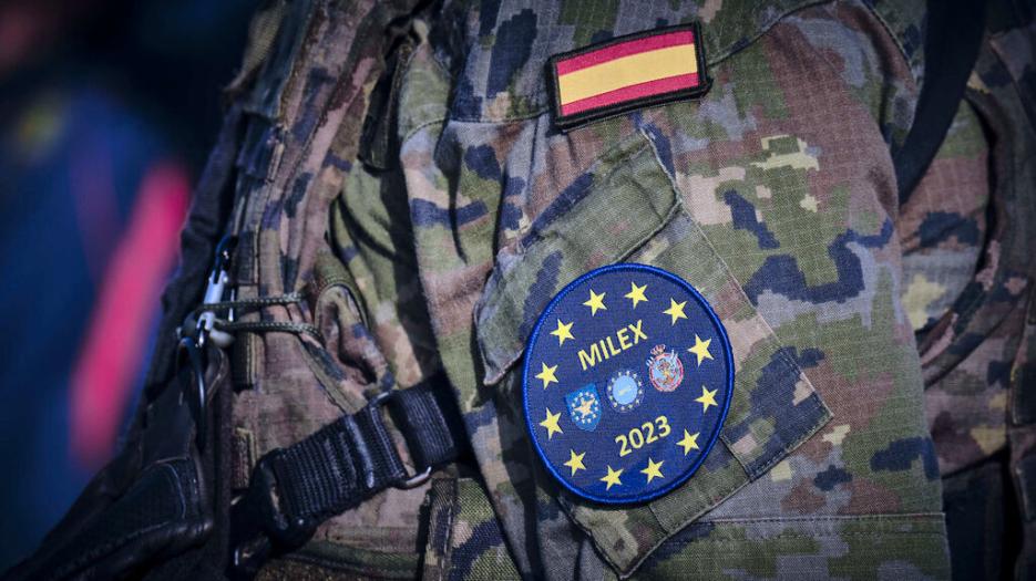 Close up of Spanish soldier's sleeve with flag of Spain and Milex mission patch. 