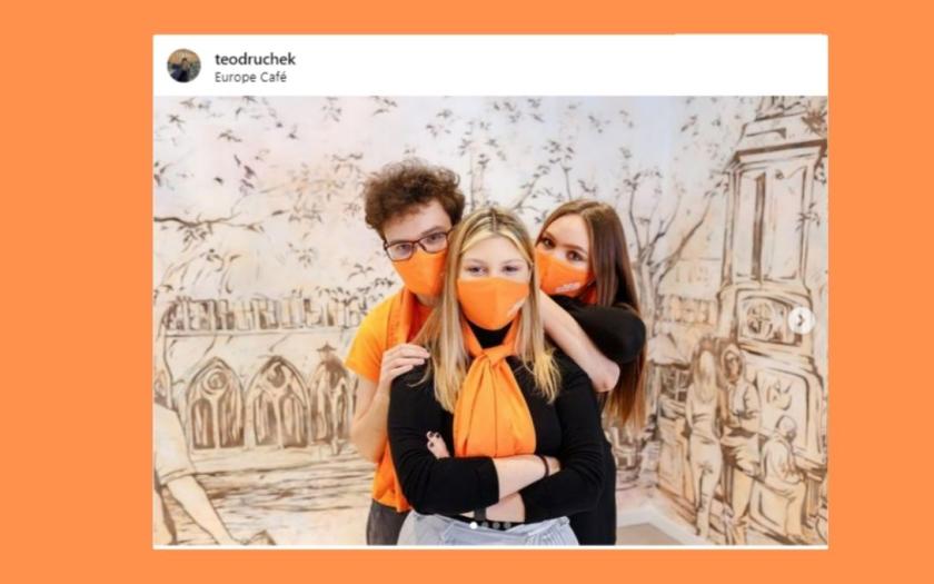 Picture of 3 young students wearing orange pieces of clothing