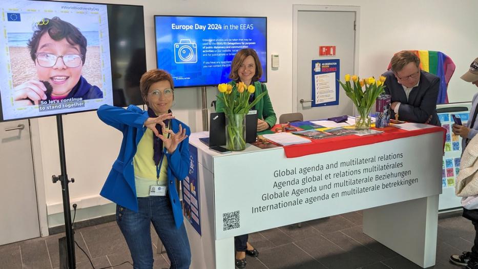 The Americas desk at openday with staff and a display