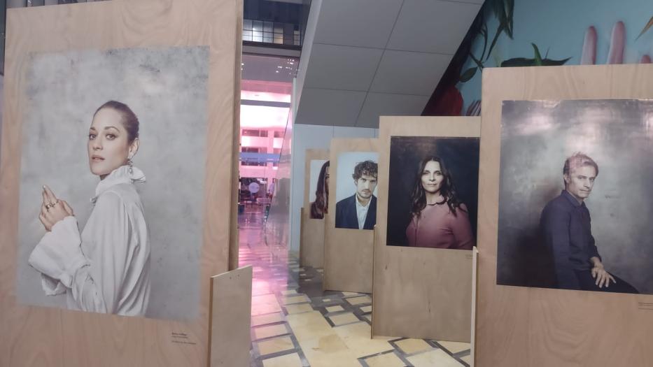 Images of film stars on display in a gallery.