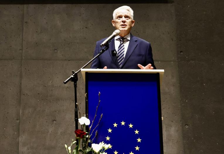 man speaking at a podium