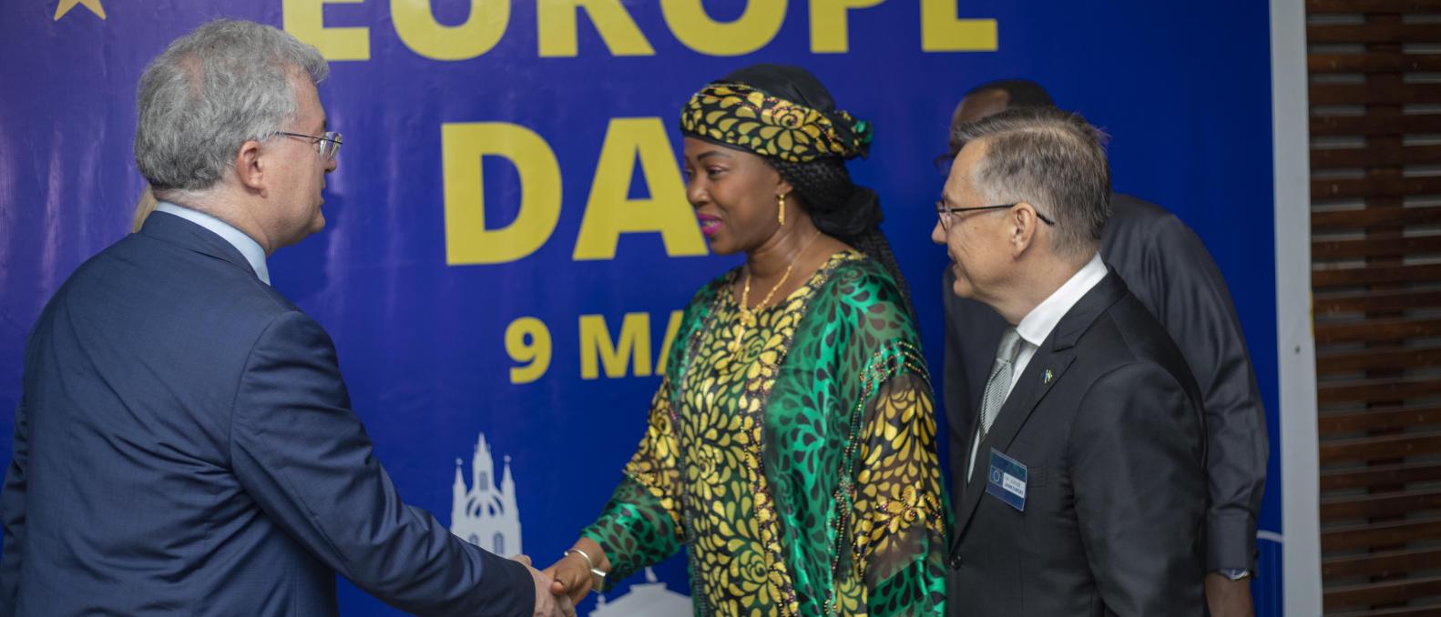 First Lady in warm hand-shake with Head of Political Section, Emilio Rossetti  