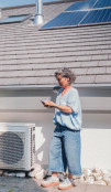 Woman standing in front of a house