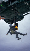 A soldier winching down from a helicopter as part of MARSEC EU 26