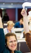 people lifting papers