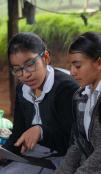 Two students looking at a tablet