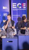 Filmmakers discuss their craft on a stage at a festival. 