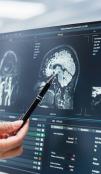 Technician examines a medical image.