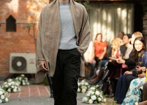 A model walks in pashmina top and shawl.