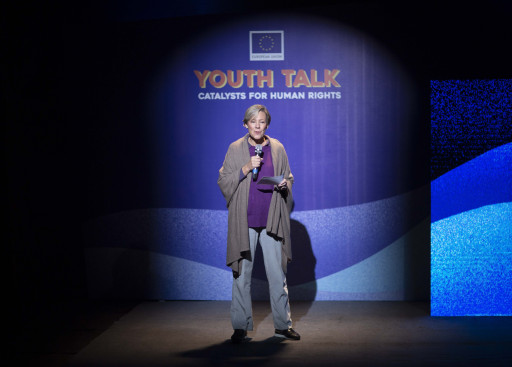 Ambassador Veronique Lorenzo on the stage.