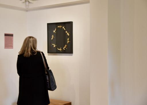 a woman taking a lot into art 