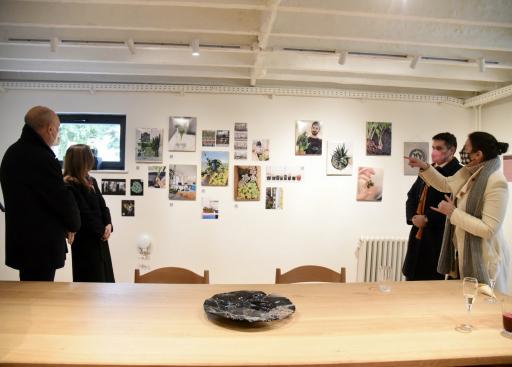 people watching an exposition