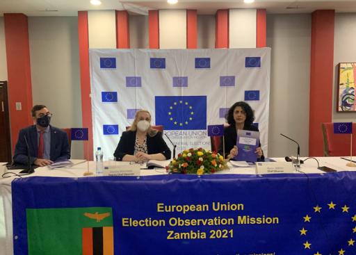 holding up report during press conference. European Union Election Observation Mission Zambia 2021 