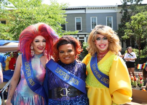 Three drag queens pose for the camera.