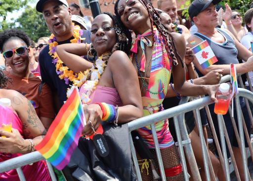 Members of the crowd watching the Capital Pride Parade.