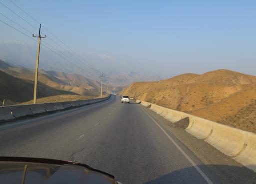 A road in the sunny mountains.