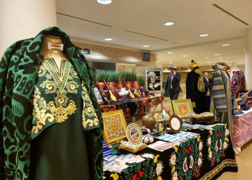 Green clothes on mannequin, table with instrument and other objects