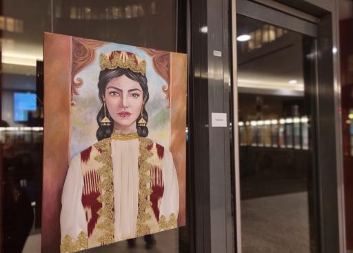 Portrait of a Tajik woman wearing a crown with gold accents on the clothes