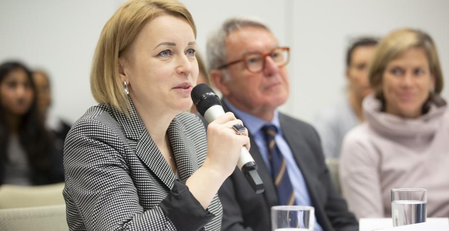 EU Ambassador Neliupsiene speaks into a microphone.
