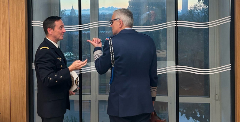 Two people in uniform talking to each other