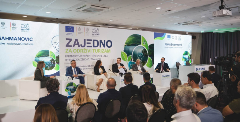Panelists and audience sitting