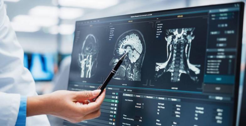 Technician examines a medical image.