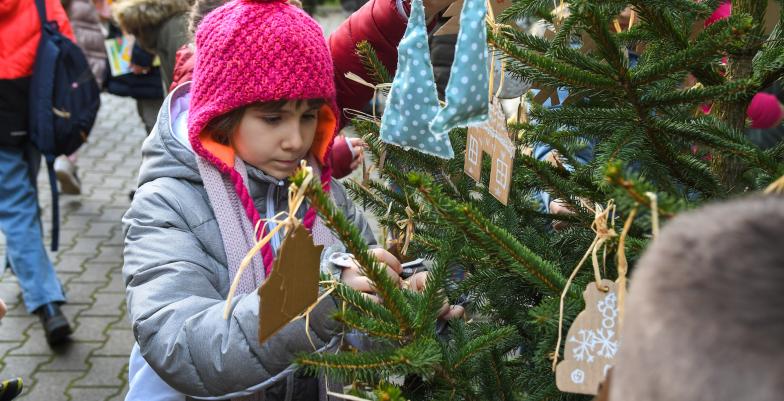 Child and festive tree