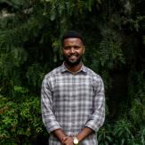 Black man on formal clothes posing to the camera